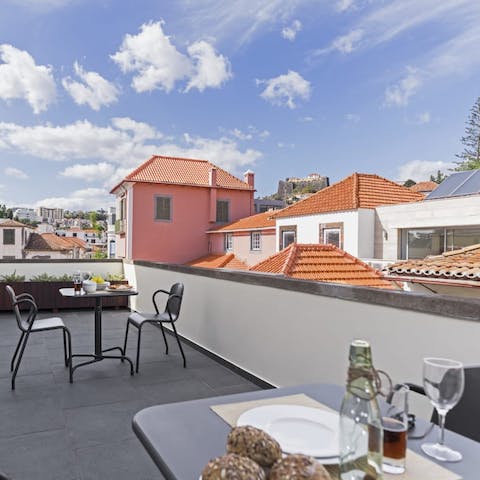 Enjoy your meals on the large private terrace, with rooftop views