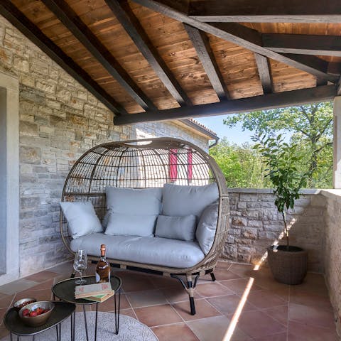 Curl up with a good book on the comfy cushioned chair