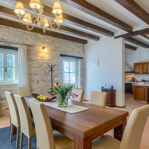 Pass around hearty bowls of Istrian stew on the wooden dining table