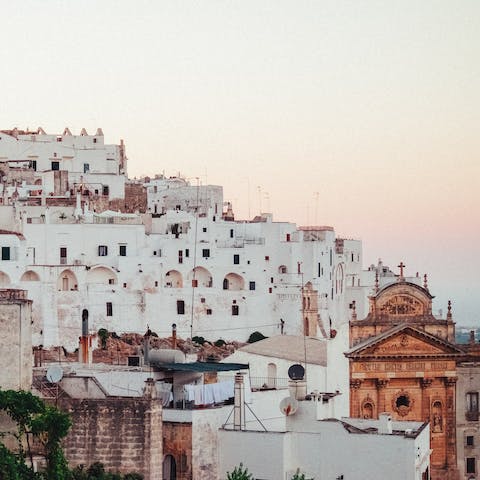 Walk along the cobbled streets of Ostuni, an eleven minute drive