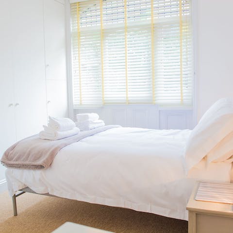 Sleep soundly in the serene white bedroom