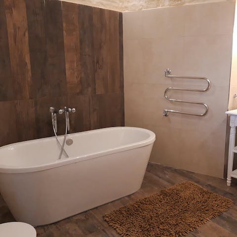 Soak in your freestanding tub at the end of an exciting day exploring the island