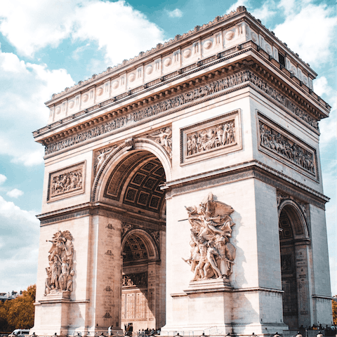 Take an eleven-minute stroll to visit the iconic Arc de Triomphe