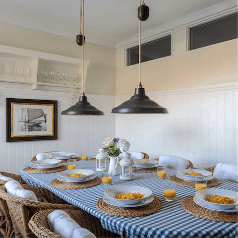 Dine on gingham cloth in the nautical style kitchen