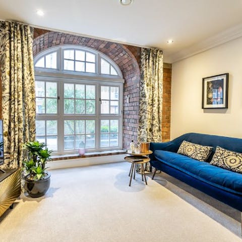 Admire original features, such as the sash windows and exposed brickwork