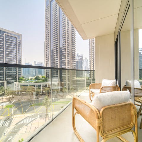 Watch the hustle and bustle of Downtown Dubai from the balcony