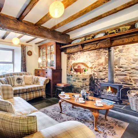 Warm up after a long walk by the traditional inglenook fireplace