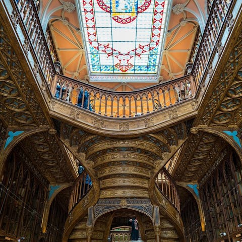 Admire Livraria Lello's ornate interiors, a thirteen-minute stroll from your door