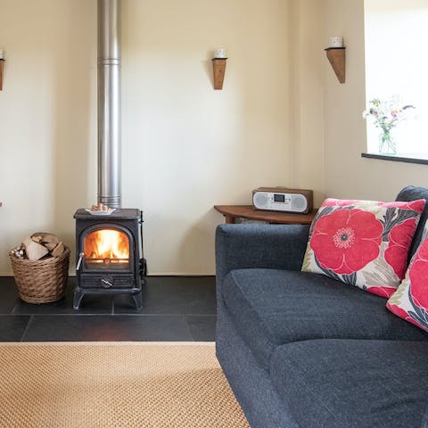 Snuggle up with a book in front of the fire after exploring the coast