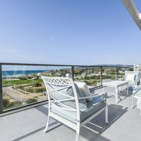Take in the sea views from the huge terrace with a seat in the sun
