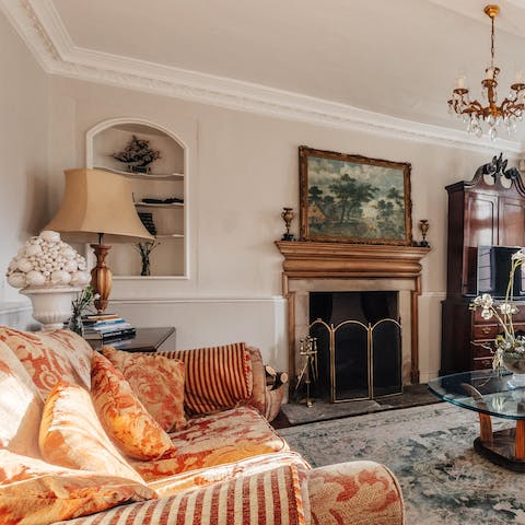 Cosy up in front of the fireplace to admire the gorgeous interiors of the drawing room 