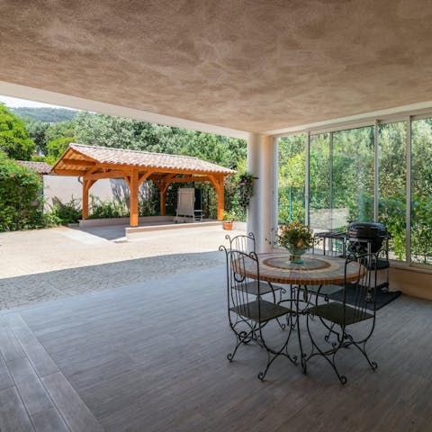 Dine outside in the shade of the covered terrace