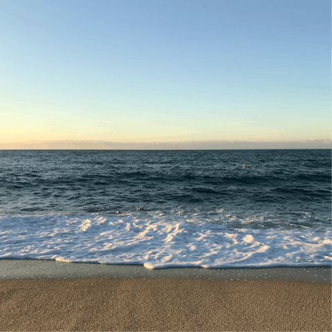Build sandcastles at Platja de Tamarit  – the beach is seven minutes away by car