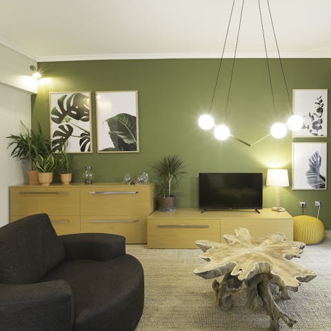 Unwind in the jungle-themed living room after sightseeing around town