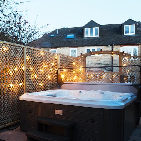 Unwind in the hot tub with a glass of fizz