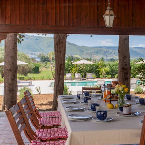 Dine alfresco on your favourite Italian dishes as you gaze out at the Sicilian mountains