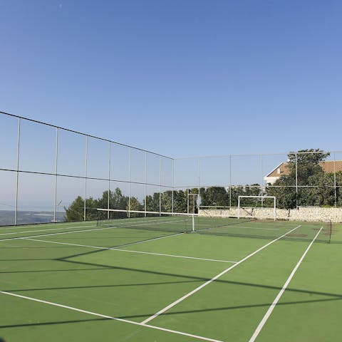 Stay active under the sun on the full-size tennis course