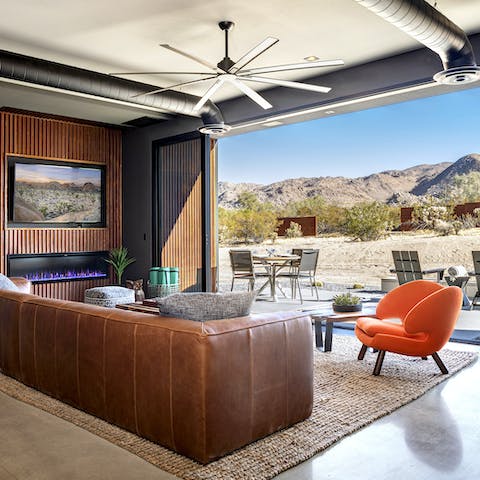 Floor-to-ceiling sliding glass doors lead out to the patio