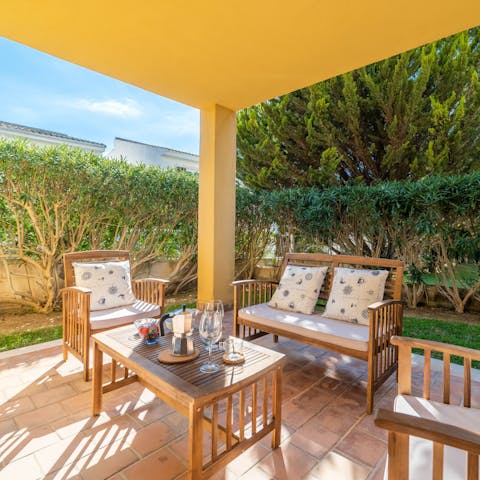 Start your mornings with a café con leche under the shaded pergola