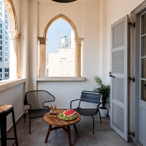 Enjoy evening drinks on the shared balcony