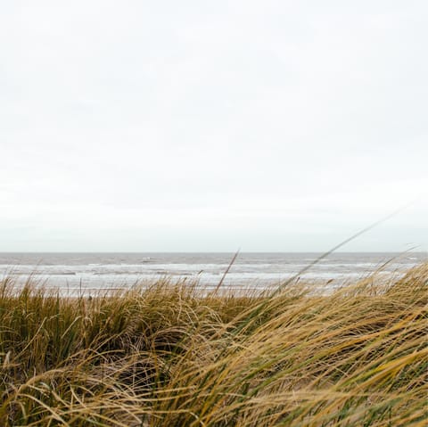 Stroll along the sandy beach at Egmond aan Zee, just a six-minute drive away