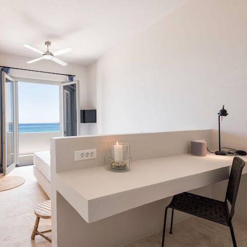Keep on top of things at the dedicated workstation, while gazing out to sea