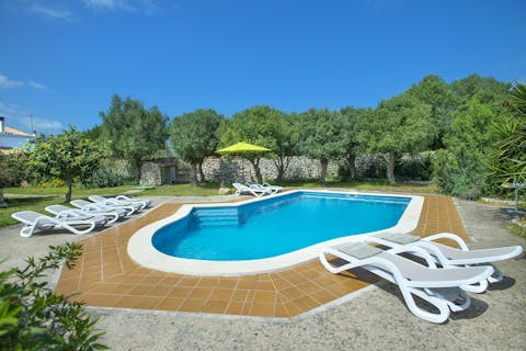 Relax by the outdoor pool before having a refreshing swim