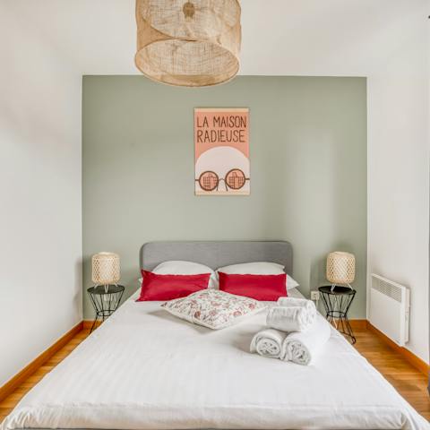 Wake up feeling refreshed in the soothing sage green bedroom