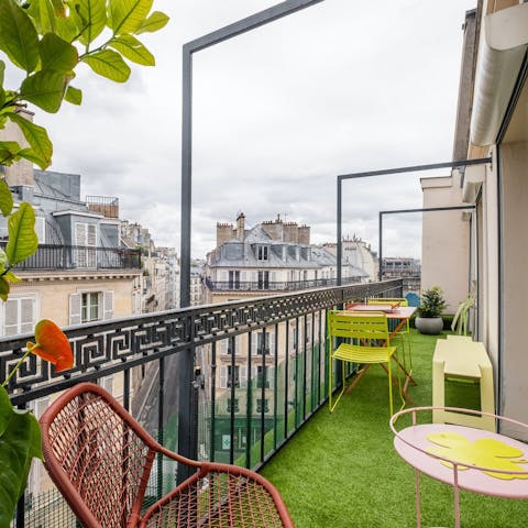 Hang out on the colourful balcony and watch a Parisian sunset