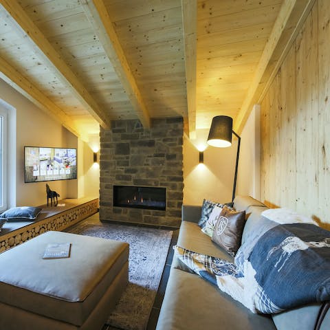 Cosy up together in front of the crackling fire
