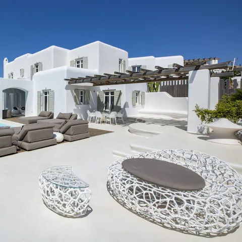 Relax in one of the many outdoor seating areas surrounding the villa