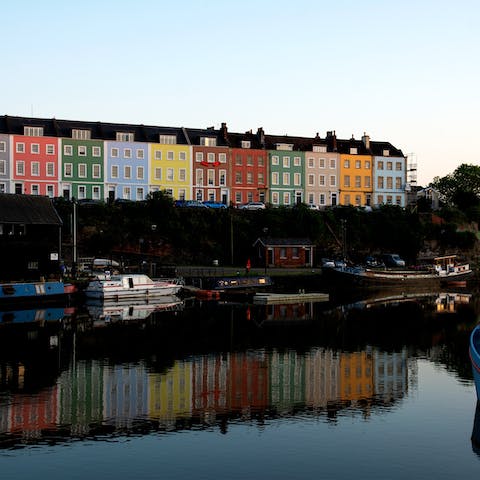 Enjoy overlooking the river from this parade of colourful homes