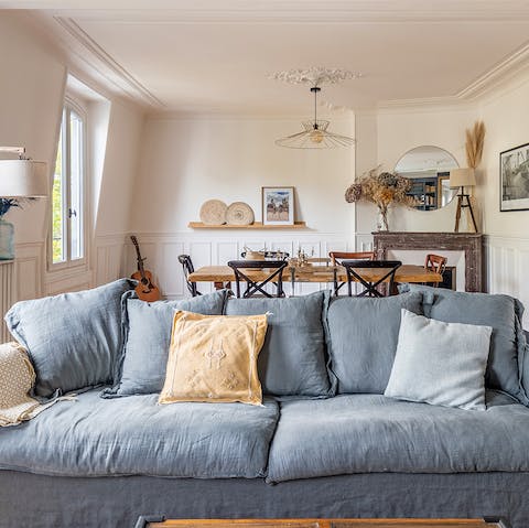 Get cosy in the plush and elegant living room 