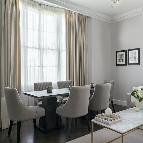 Gather together for a meal in the elegant dining area