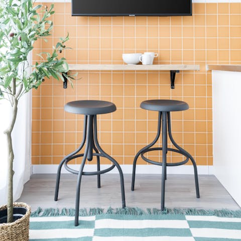 Sit down to breakfast at the cheerful tangerine dining nook
