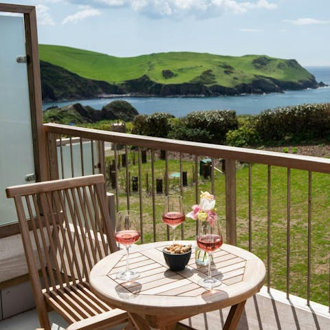 Enjoy a glass of wine on the balcony while admiring the sea views