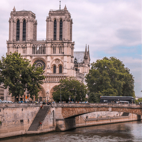 Stroll along the river to admire the majestic sight of Notre Dame Cathedral