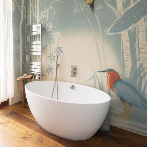 Treat yourself to a soak in the deep free-standing bathtub 