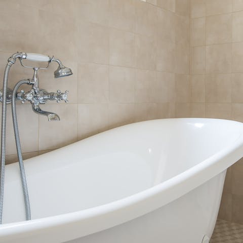 Relax with a long soak in the freestanding tub after a day of sightseeing