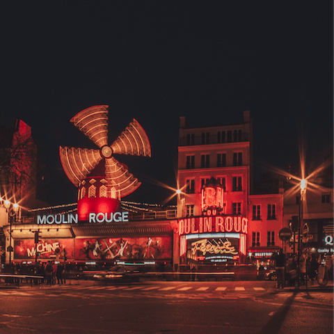 Visit Montmartre's iconic Moulin Rouge, a seven-minute stroll from your door