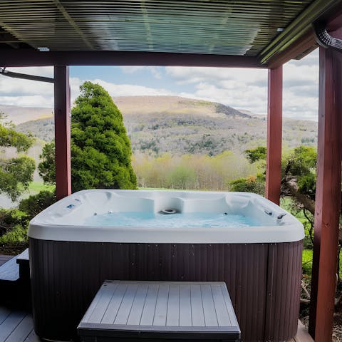 Relax in the hot tub while enjoying the sweeping views