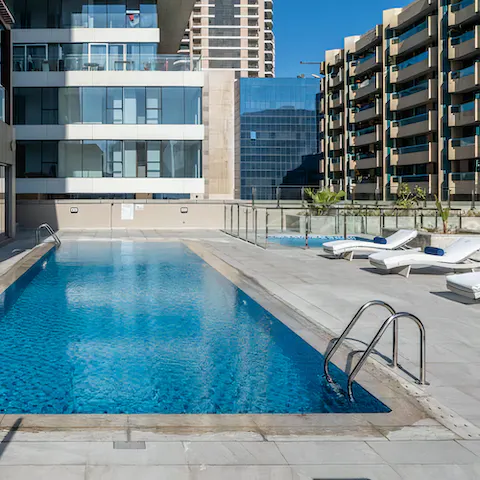 Cool off from Dubai's heat in the communal swimming pool