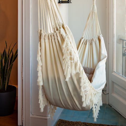 Unwind with a good book in the balcony's hammock 