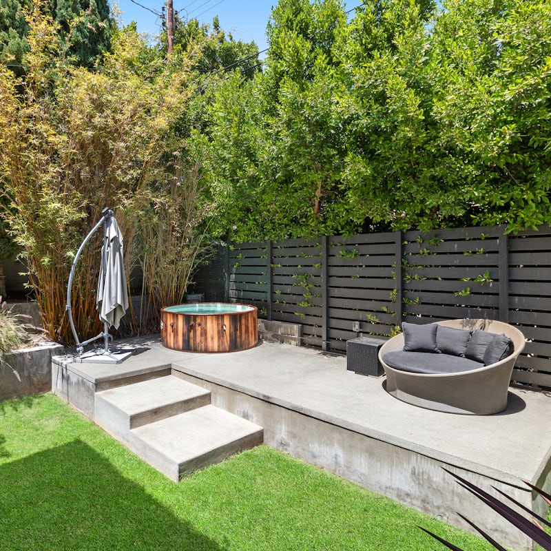 Step into the garden and enjoy a long soak in the jacuzzi