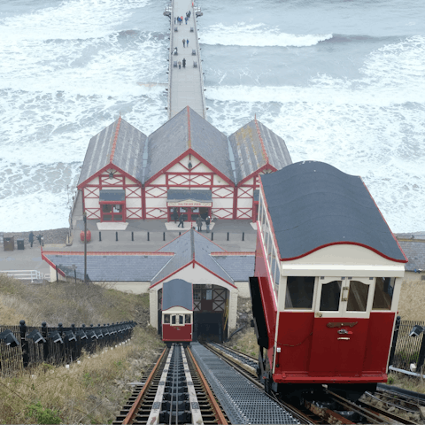 Ride a tram on the Saltburn cliff tramway, just a thirteen–minute drive away