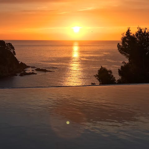 Watch the sun set from the infinity pool