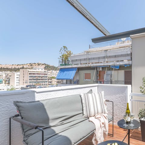 Enjoy views of Filopapou Hill from the apartment's roof terrace