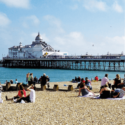 Explore Eastbourne, with its 19th-century pier, under a twenty-minute drive away