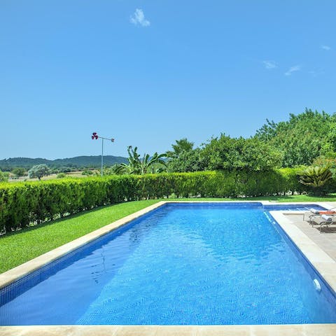 Admire the lush green hills from the private swimming pool