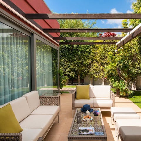 Sprawl out on one of the terrace's outdoor sofas with a book in hand